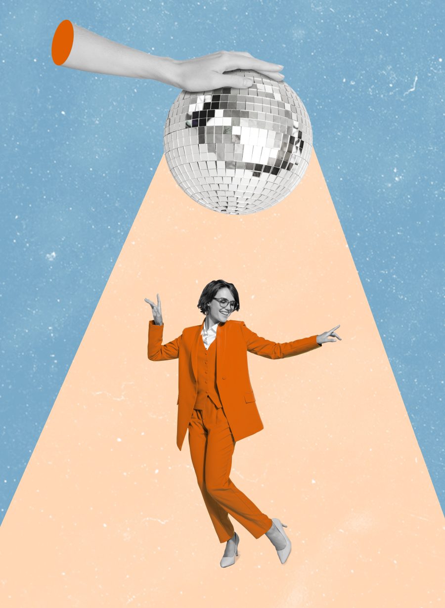 Woman dancing beneath disco ball
